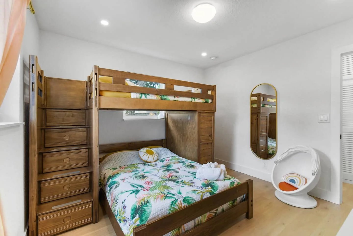 Stairs make for easier bunk access. 

The kids will love the swivel egg chair!