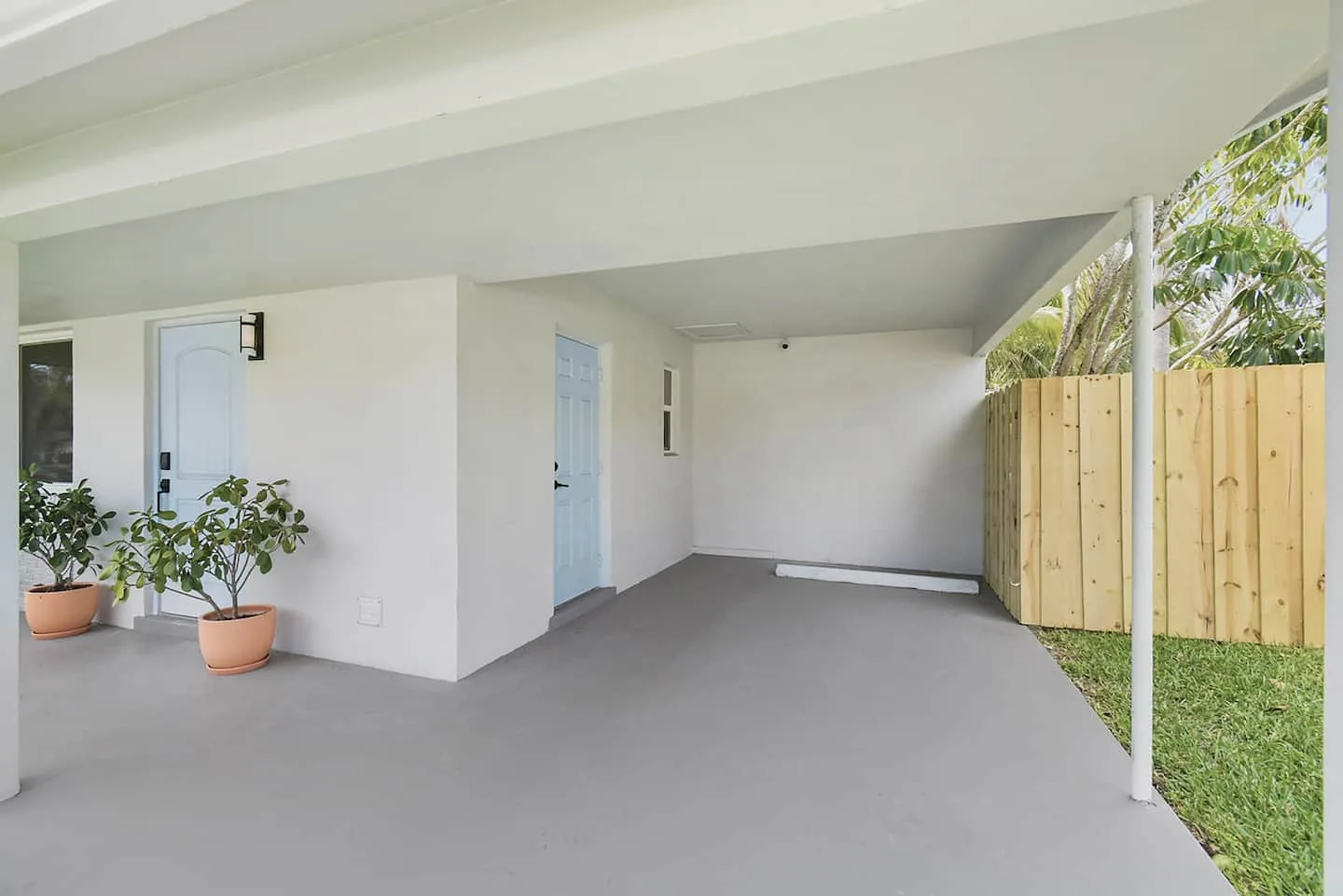 The covered carport fits one vehicle. The driveway fits an additional vehicles.