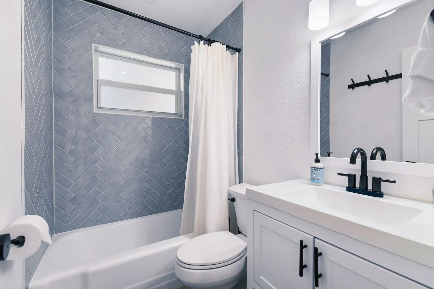The main bathroom has a shower/tub combo. We do provide shampoo, conditioner and body wash. Frosted hurricane impact windows provide natu…
